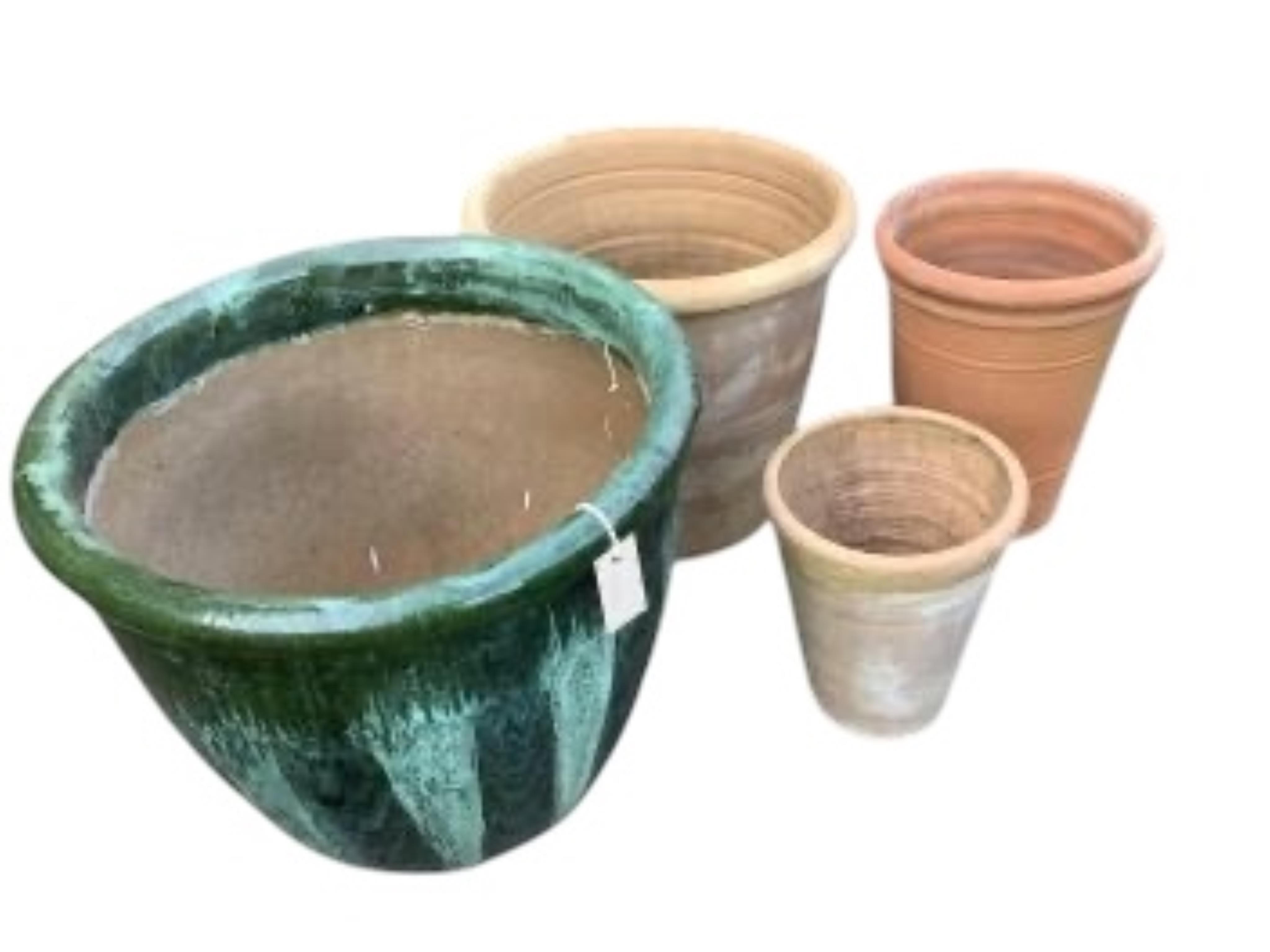 Three circular terracotta garden planters, largest diameter 49cm, height 41cm